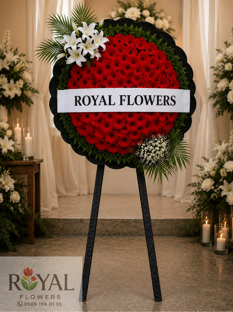 premium-kirmizi-gerbera-beyaz-lilyum-cenaze-celengi.webp Canlı kırmızı gerbera ve beyaz lilyumlarla hazırlanan Premium cenaze çelenk