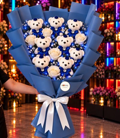 LED'li mega boy mavi elbiseli 7'li peluş ayıcık buketi, 5 beyaz gül ve mavi LED ışıklı Royal Flowers